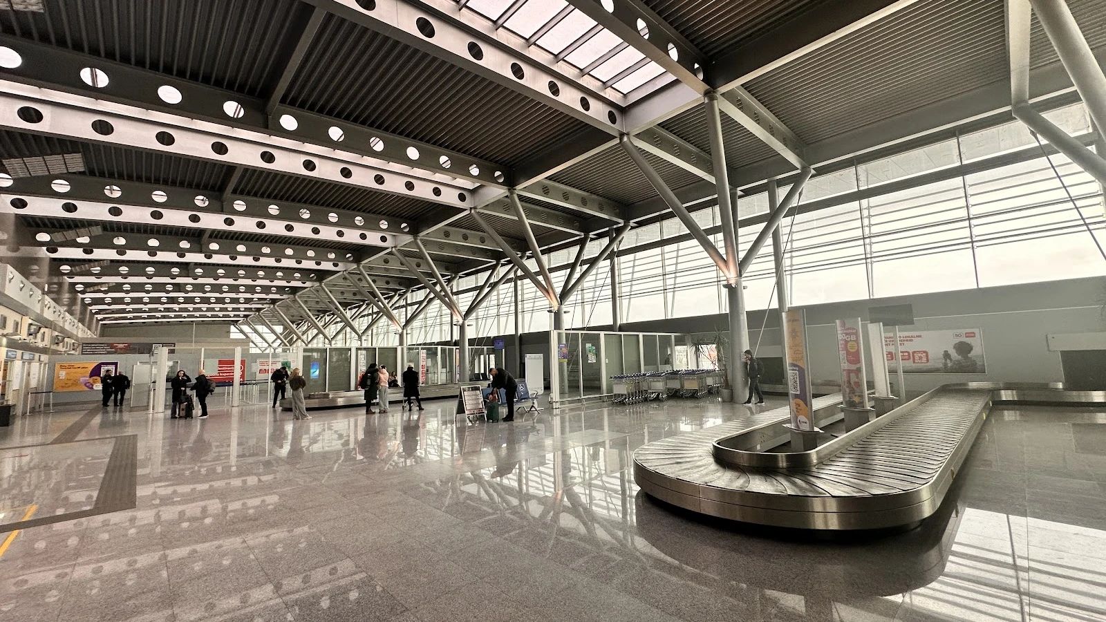 Podgorica Golubovci Airport terminal exterior with car hire pickup zone